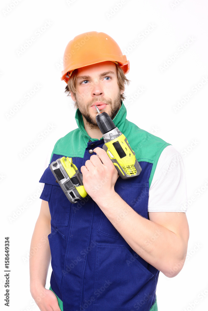 Laborer with cordless drill in hand and thoughtful face expression