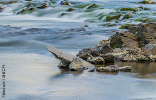 Background of Carpathian mountain river with long exposure photo