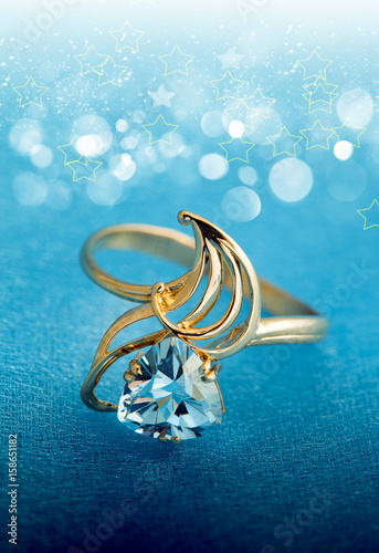 Elegant female jewelry ring with blue topaz