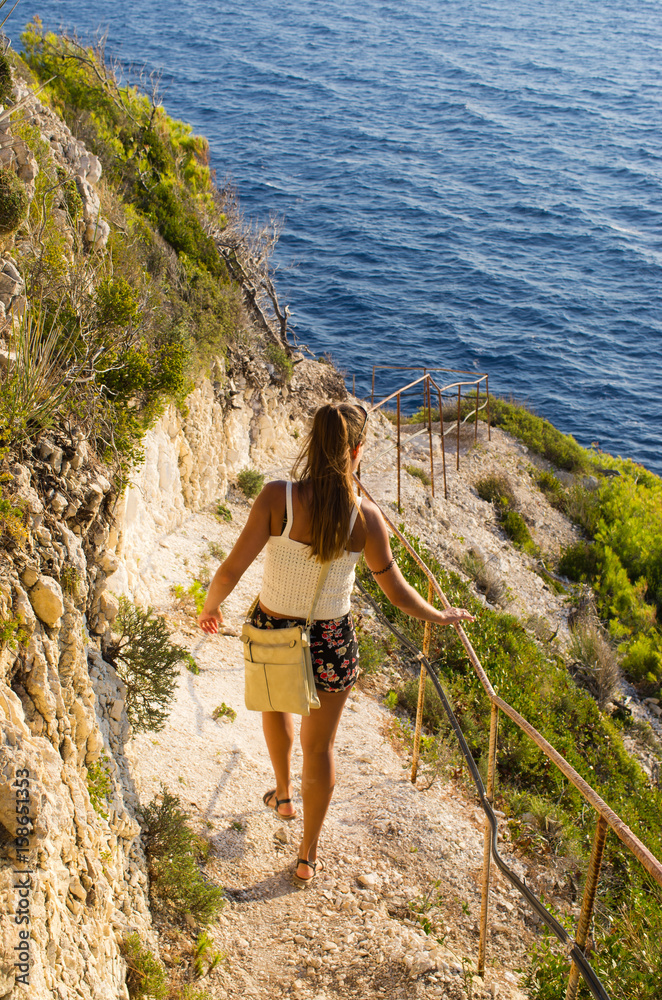 Woman on cliff of Zakynthos island - Agalas, Greece