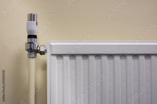 Thermostat on a radiator as part of gas central heating system