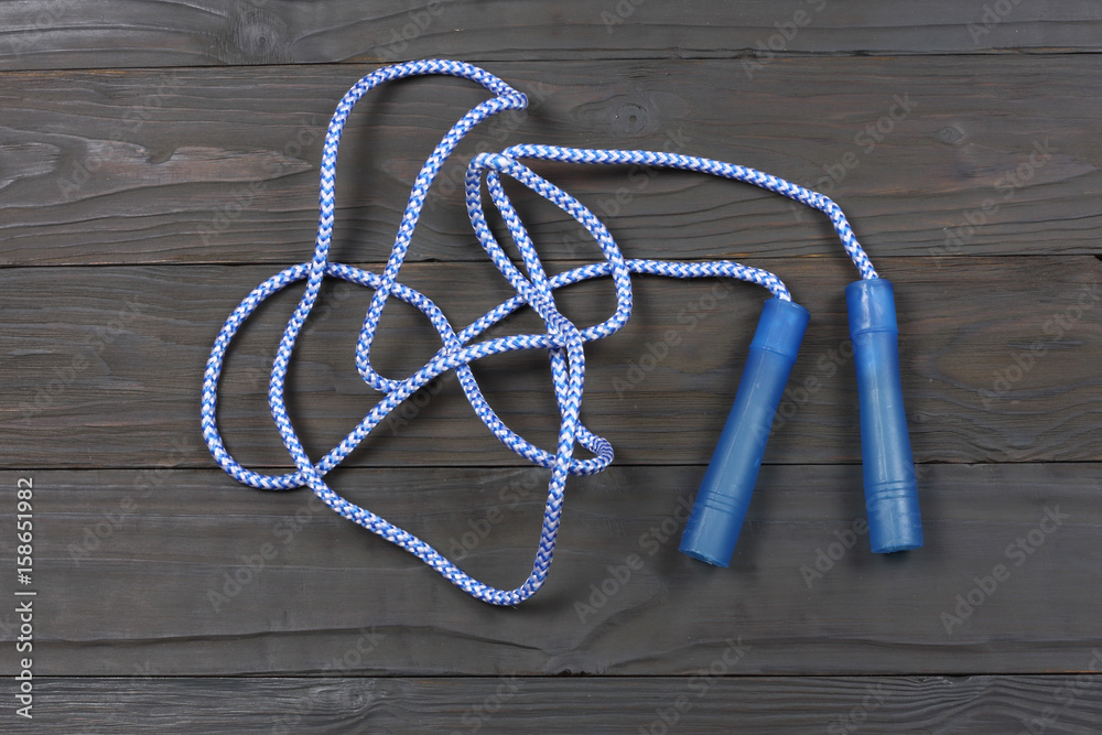 Top view of Jump rope on wooden background Top view of Jump rope on wooden background