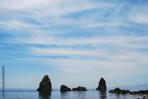 The protected marine reserve with the characteristic sea stacks in Acitrezza. Sicily