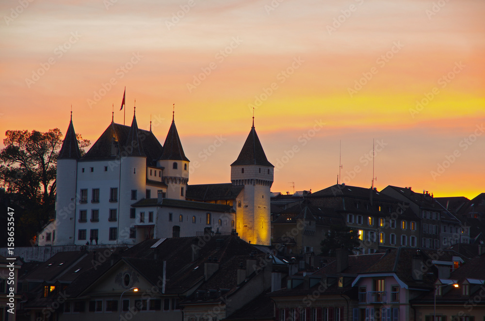 The medieval Nyon Castle during colorful dusk