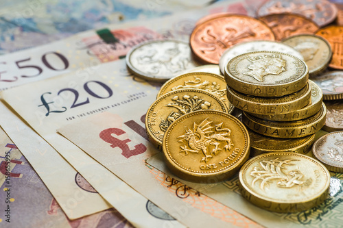 British coins stack on black, pound sterling