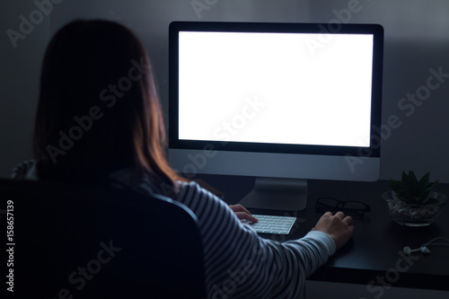 Woman woking Computer at night