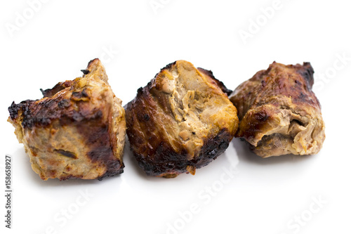 Grilled shish kebab or shashlik on skewers closeup on white background