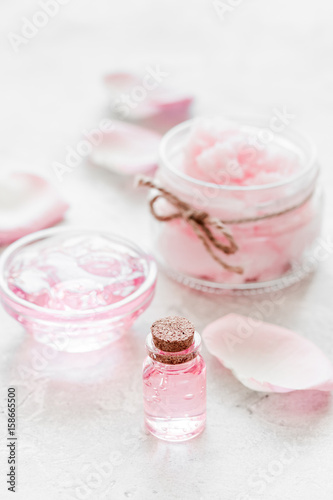 homemade spa with rose cosmetic set  cream  salt and oil on white background