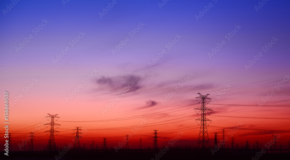 Fototapeta premium High voltage towers, silhouette in the evening