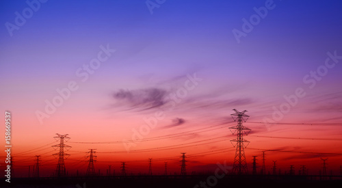 High voltage towers, silhouette in the evening