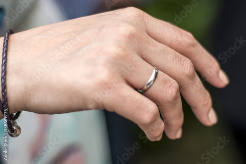 Bride hand with wedding ring closeup detail