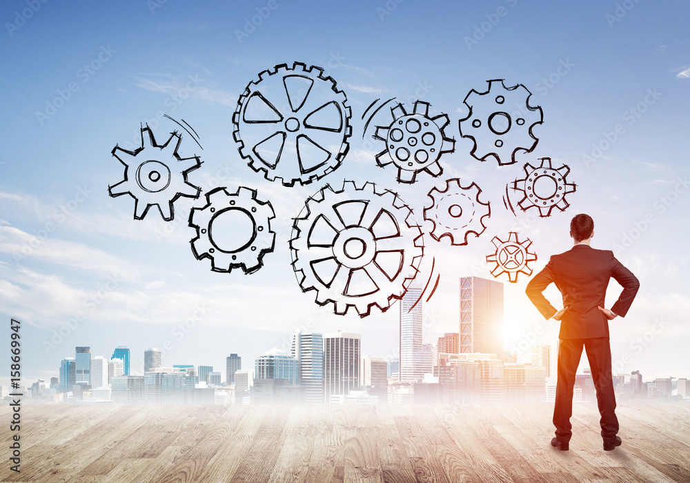 Cogwheel engine drawn on screen as symbol for teamwork and cooperation Cogwheel engine drawn on screen as symbol for teamwork and cooperation
