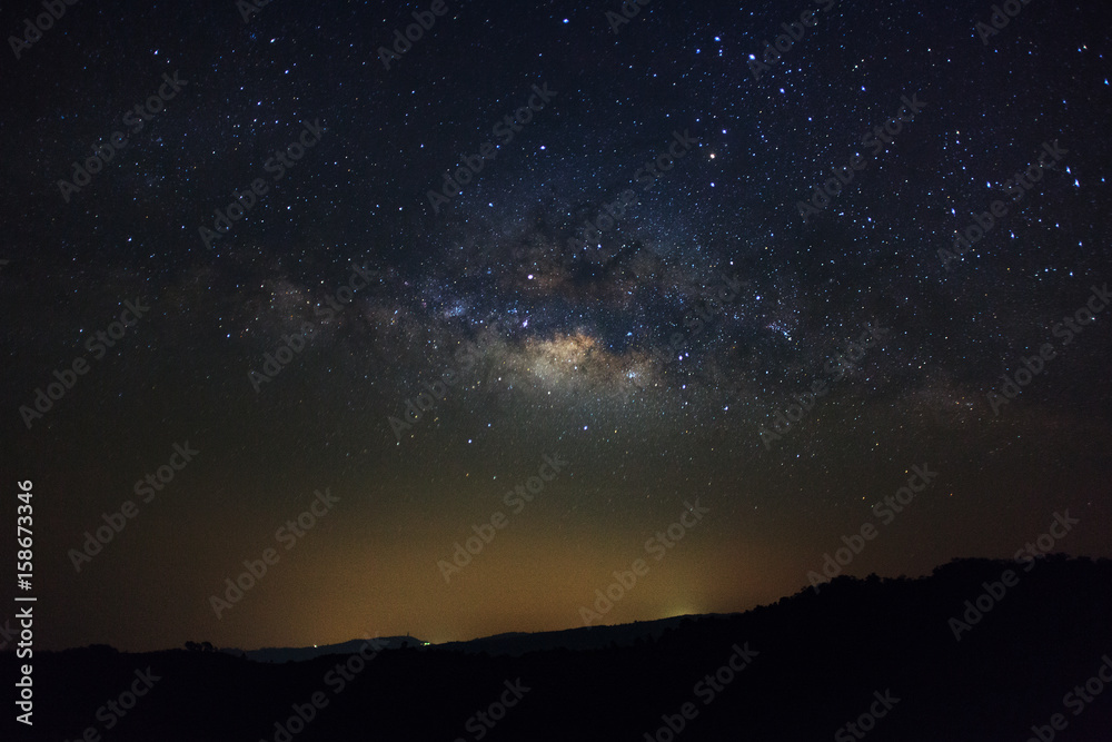 Milky Way over mountain at Phu Hin Rong Kla National Park,Phitsanulok Thailand, Long exposure photograph.with grain Milky Way over mountain at Phu Hin Rong Kla National Park,Phitsanulok Thailand, Long exposure photograph.with grain