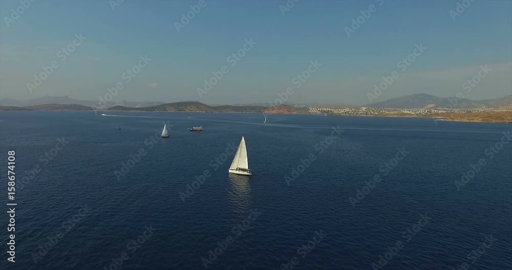 Sailboats Cruising at Aegean Sea Bodrum, Turkey Sailboats Cruising at Aegean Sea Bodrum, Turkey