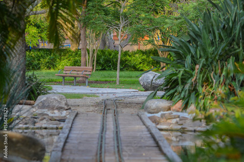 Empty bench and kids train track in Largo Central Park in Largo  Florida  USA