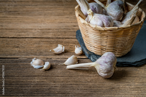 Garlic on black stone plate photo