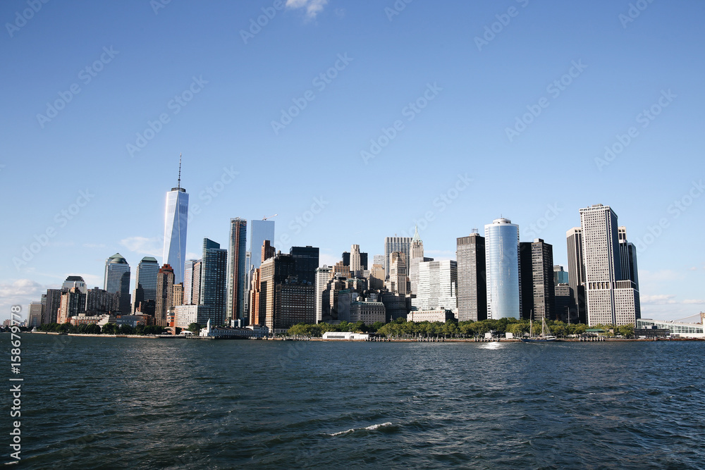 Manhattan skyline. Boat ride on Hudson river. Sunny summer day. Travel, vacation, sightseeing, New York, tourism, and urban living concept