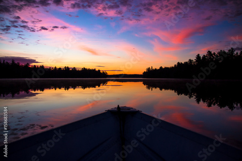 Sunrise on a row boat photo