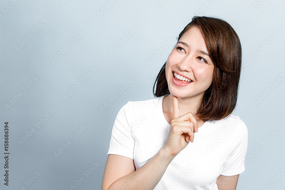 young woman looking up, getting an good idea concept young woman looking up, getting an good idea concept