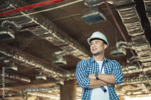 View of a Worker and architect watching some details on a construction