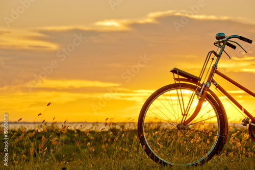 bicycle silhouette at the sunset or sunrise