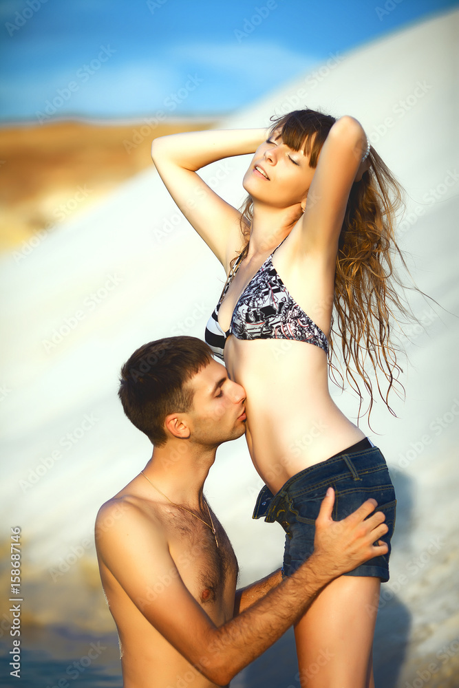 Man kissing girl on beach Stock Photo | Adobe Stock