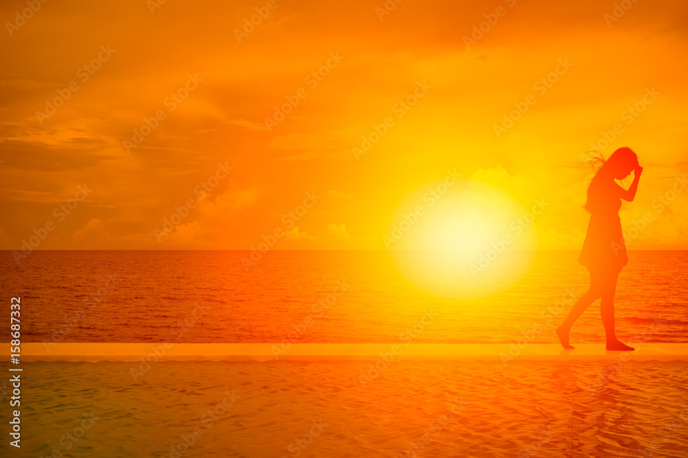 women walk away. silhouette of girl on the beach with summer sea beautiful sunset  background Stock Photo | Adobe Stock