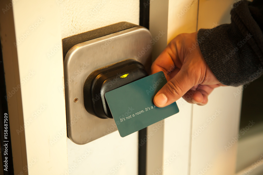 Traveler opening hotel room door by plastic keycard Stock Photo Adobe