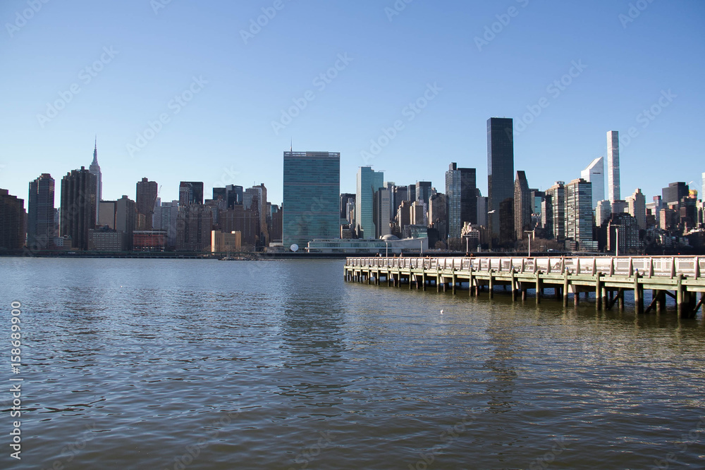 Buildings in Manhattan and East river from Gantry Plaza State Park view