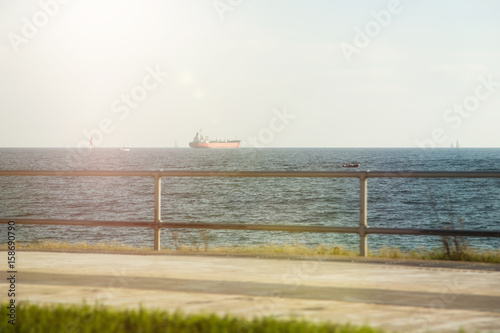 Seafront promenade with views of ships © sandradombrovsky