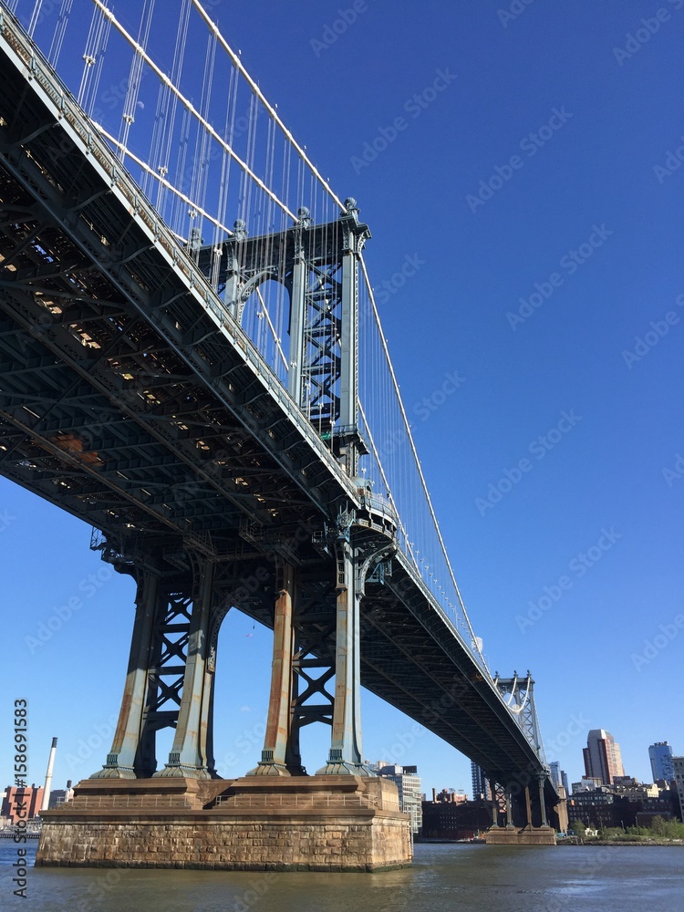 Manhattan bridge over the river and city with clearly sky in vintage style, New York Manhattan bridge over the river and city with clearly sky in vintage style, New York