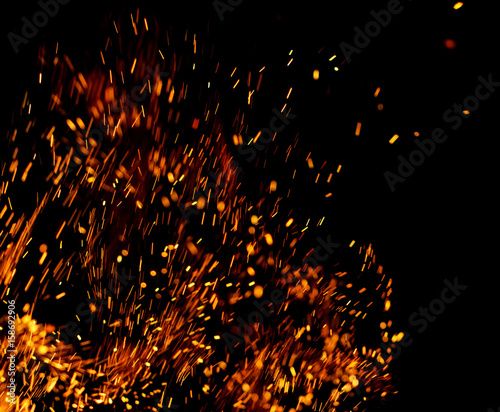 Flame of fire with sparks on a black background