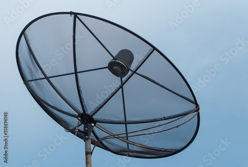 Satellite dish communication network and blue sky.