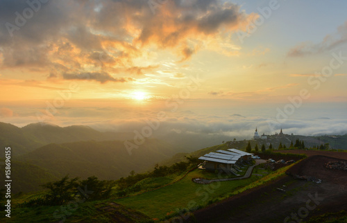 sun over mountain mist in sunrise,mist on sunrise,mist over mountain during sunrise