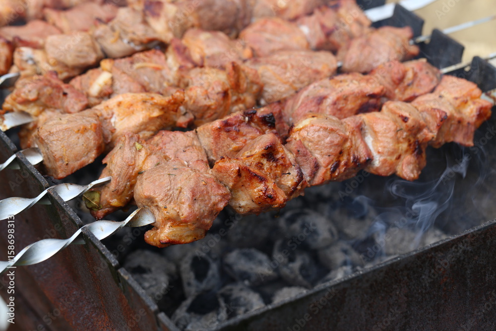 Meat is grilled / Schaschlik / Barbecue cooking