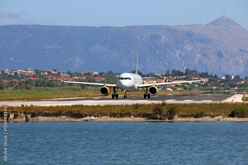 Fototapeta premium passenger airplane on Corfu airport summer season