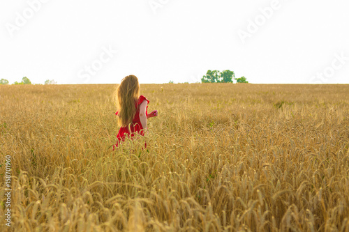 woman run on wheat field