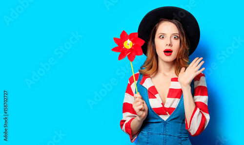 Woman with red pinwheel