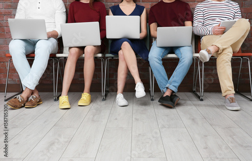 Young people with gadgets s...