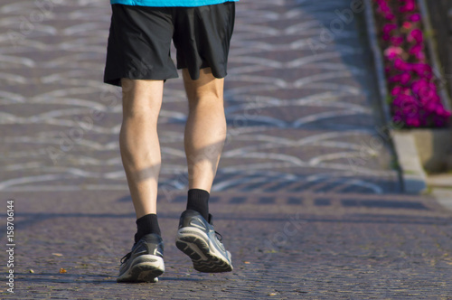 man running with sneakers