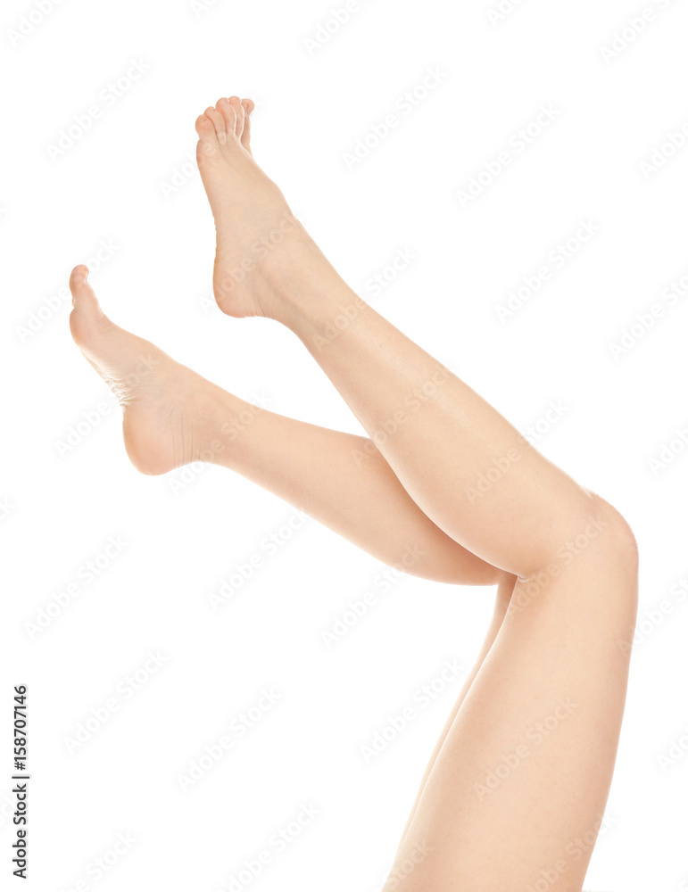 Epilation concept. Legs of beautiful young woman on white background Epilation concept. Legs of beautiful young woman on white background
