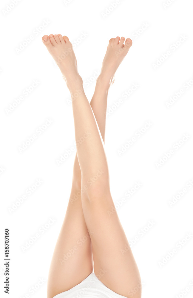 Epilation concept. Legs of beautiful young woman on white background Epilation concept. Legs of beautiful young woman on white background