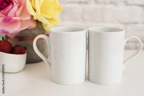 Two Mugs. White Mugs Mockup. Blank White Coffee Mug Mock Up. Styled Photography. Coffee Cup Product Display. Two Coffee Mugs On White Desk. Vase With Pink Roses