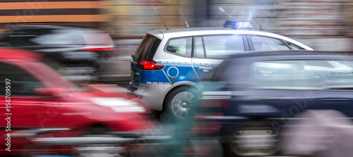 german police car speeding in city traffic