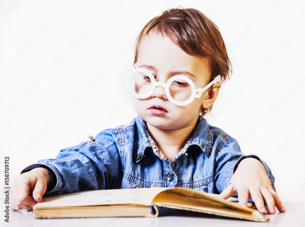 beautiful little child girl learns to read (success, education,  development)