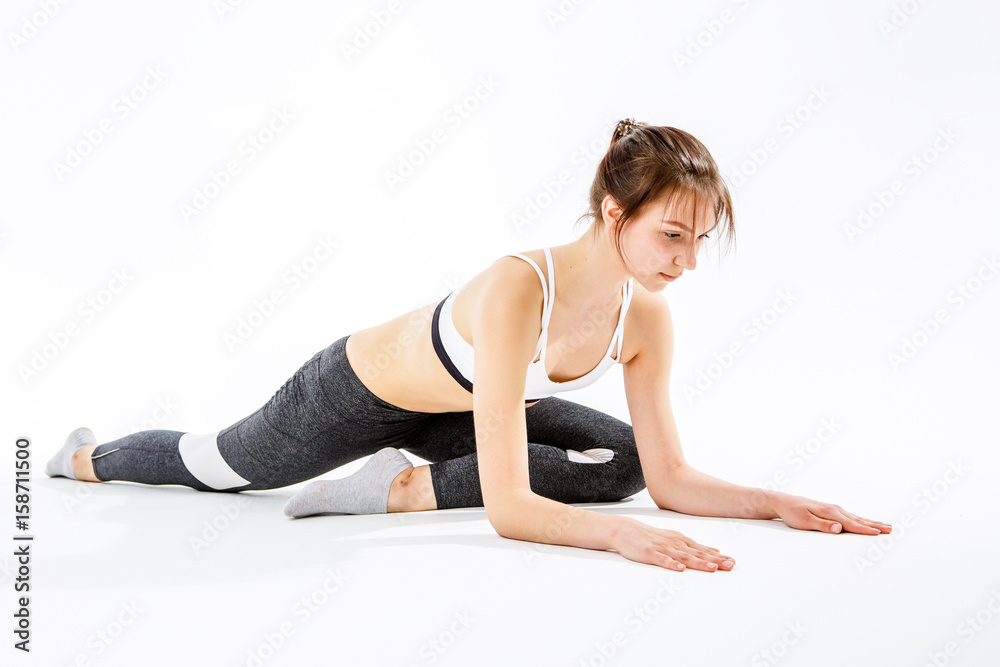 Sporty girl doing stretching exercises Sporty girl doing stretching exercises