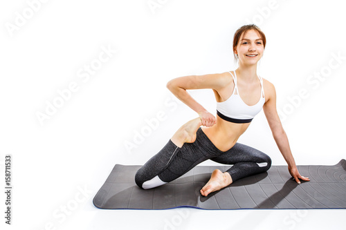 Woman doing exercises on mat