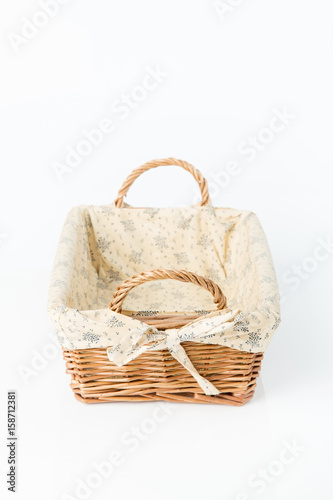 Close up of wicker basket. Isolated on a white background.