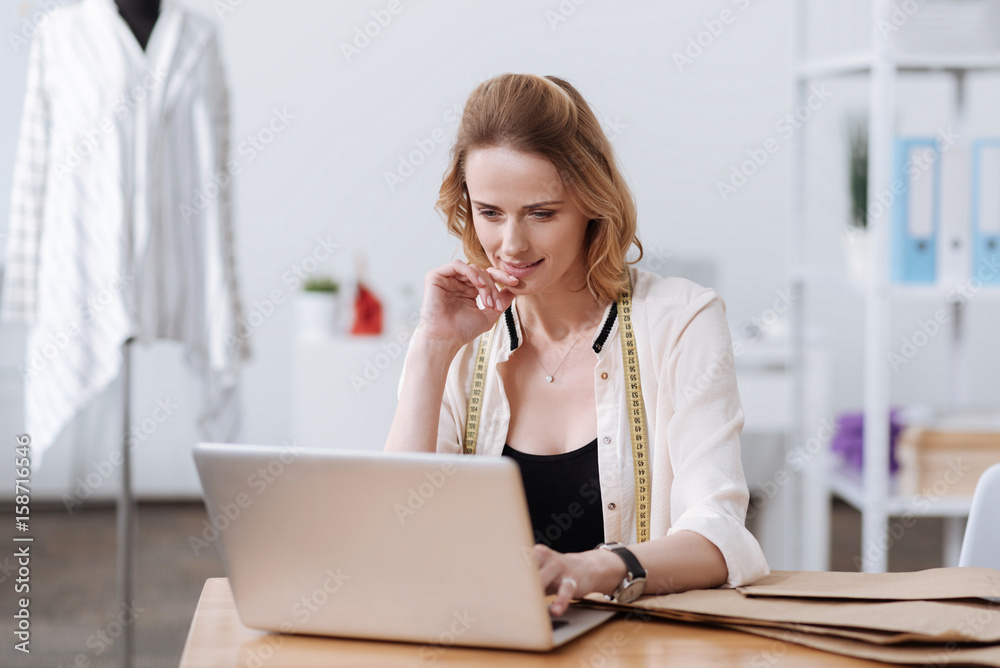 Pretty smiling woman working on laptop Pretty smiling woman working on laptop