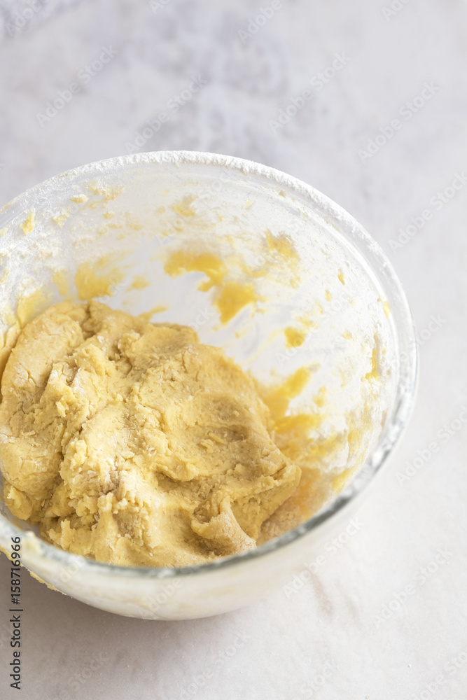 MIxing baking ingredients in a bowl for cake or pancakes. Light food photography concept MIxing baking ingredients in a bowl for cake or pancakes. Light food photography concept
